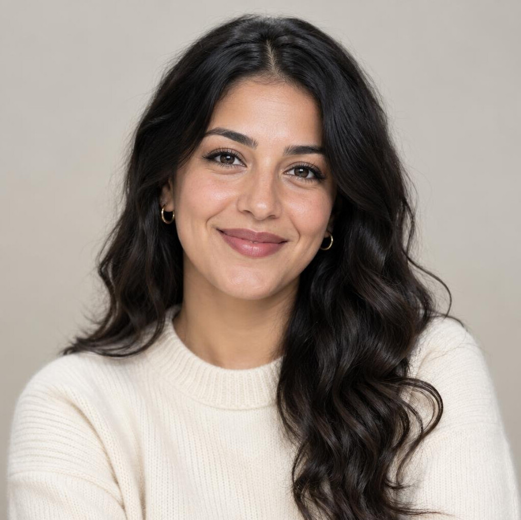 Portrait of a young woman with long hair looking at the camera